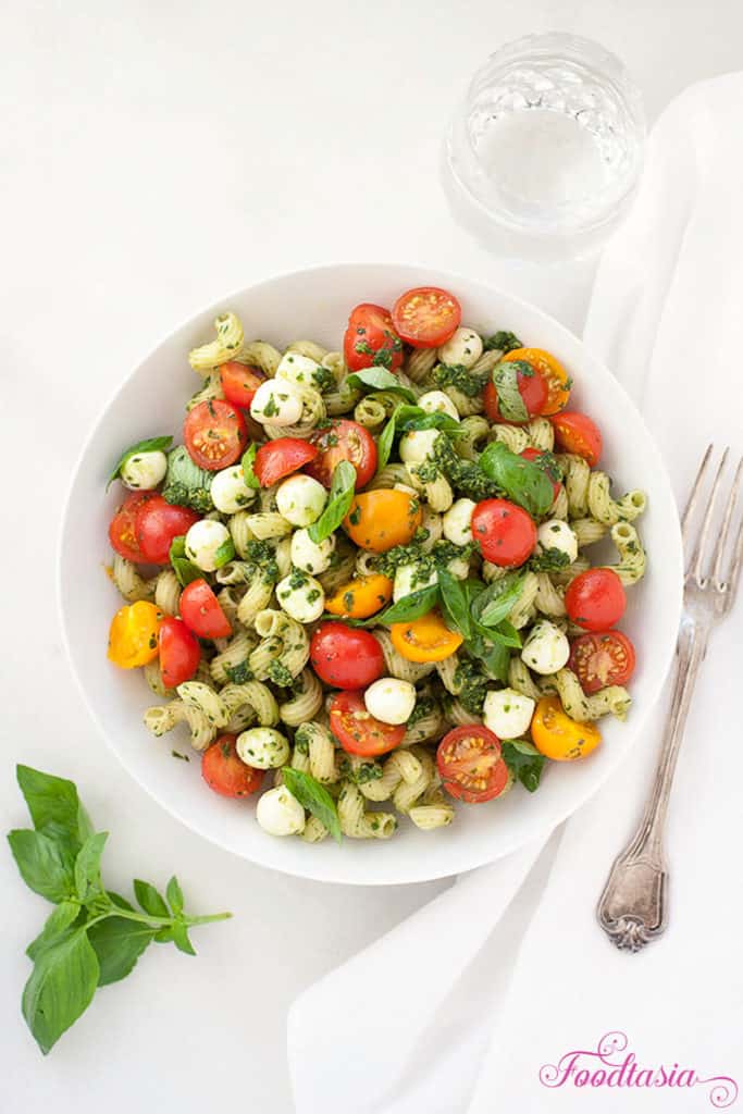 Full of fragrant basil, juicy sweet tomatoes, garlicky pesto, and creamy fresh mozzarella, Pasta Caprese with Pesto, Cherry Tomatoes, and Fresh Mozzarella is bursting with fresh summer flavors. Delicious served warm or cold.