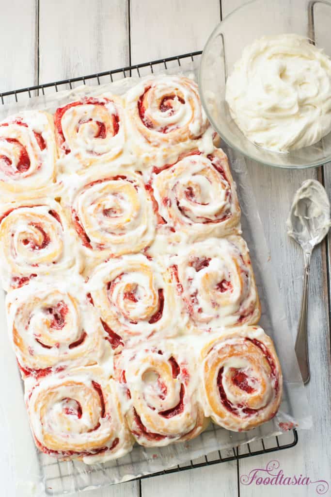 A soft, tender roll enveloping a sweet and tangy fresh strawberry swirl, topped with a cream cheese glaze with a hint of lemony citrus. Fresh Strawberry Sweet Rolls with a Lemony Cream Cheese Glaze make a delightful breakfast. 