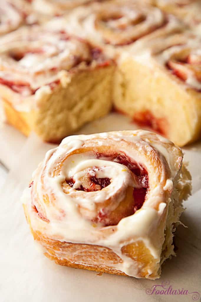 A soft, tender roll enveloping a sweet and tangy fresh strawberry swirl, topped with a cream cheese glaze with a hint of lemony citrus. Fresh Strawberry Sweet Rolls with a Lemony Cream Cheese Glaze make a delightful breakfast. 