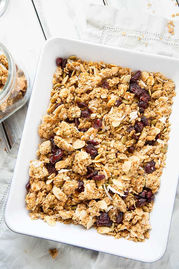 Crunchy clusters of honey sweetened granola made with dried cherries, whole rolled oats, slivered almonds, pepitas, and coconut, roasted with a touch of cinnamon, this Honey Almond Crunch Homemade Granola is wonderfully delicious!