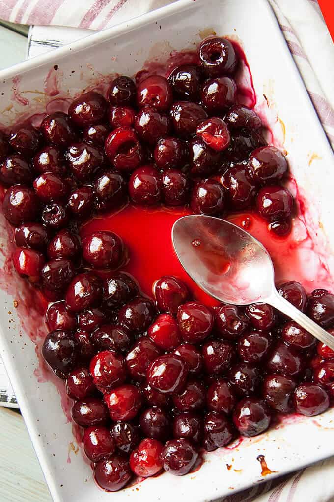 Roasted Cherries are absolutely magical! They come out shiny and glistening and gorgeous! Their flavor intensifies and they have just the right amount of syrupiness. Enjoy Roasted Cherries spooned over ice cream, cheesecake, crepes, or yogurt.