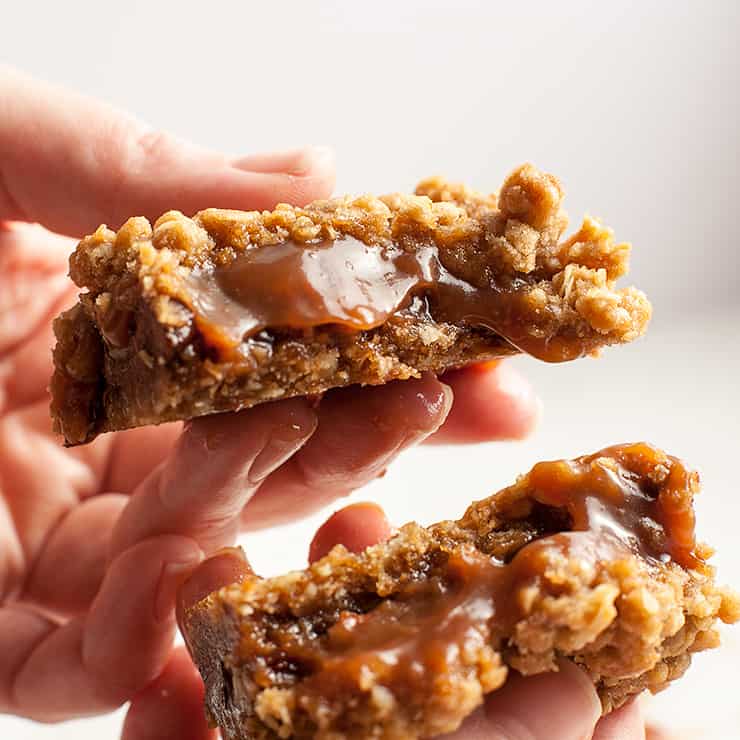 Chewy, gooey Salted Caramel Oatmeal Carmelitas - pockets of gooey, salted caramel oozing out from in between chunks of chocolate and crunchy pecans, all nestled in a brown sugar, oatmeal cookie crust and topped with an oatmeal streusel topping - Caramel Euphoria!