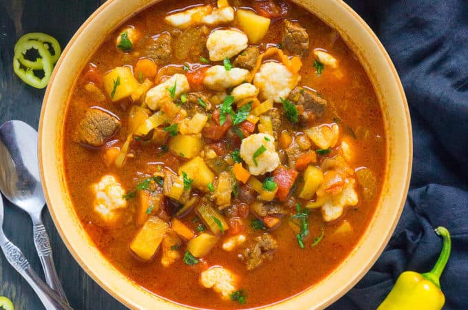 Fragrant with Hungarian Paprika and Hungarian Hot peppers and brimming with chunks of tender beef, healthy vegetables, and homemade pinched csipetke noodles, Hungarian Goulash (Gulyás) is a heart warming, soul satisfying comfort food.