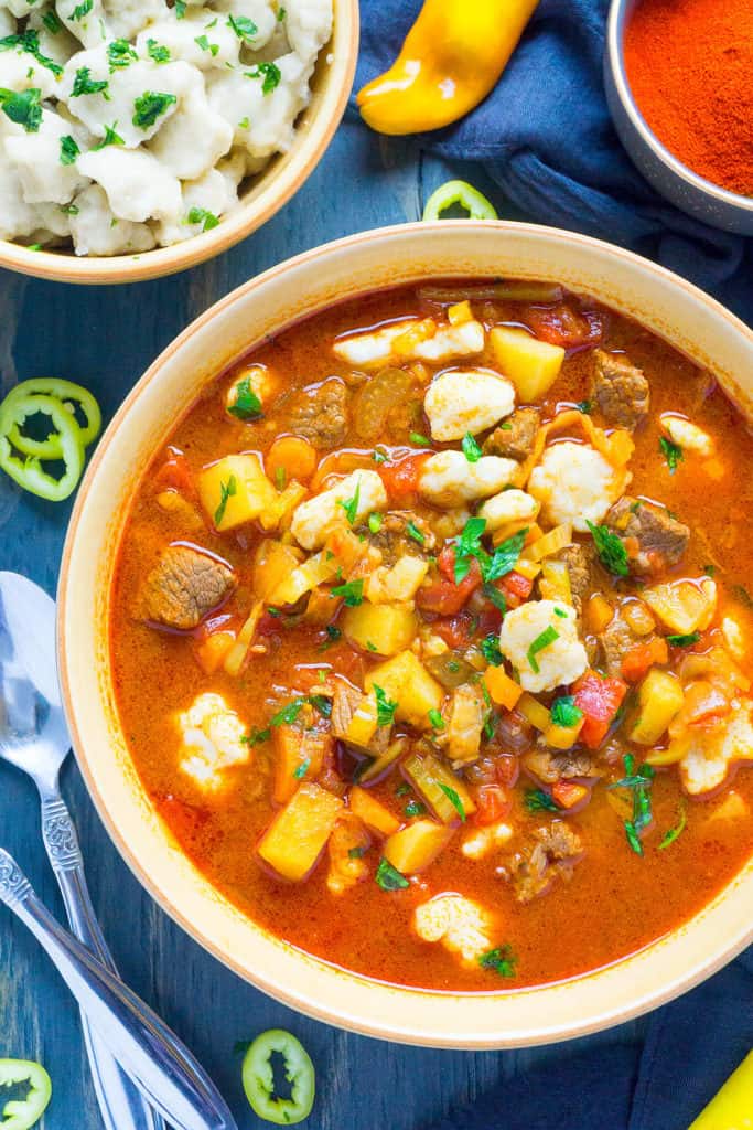 Fragrant with Hungarian Paprika and Hungarian Hot peppers and brimming with chunks of tender beef, healthy vegetables, and homemade pinched csipetke noodles, Hungarian Goulash (Gulyás) is a heart warming, soul satisfying comfort food.