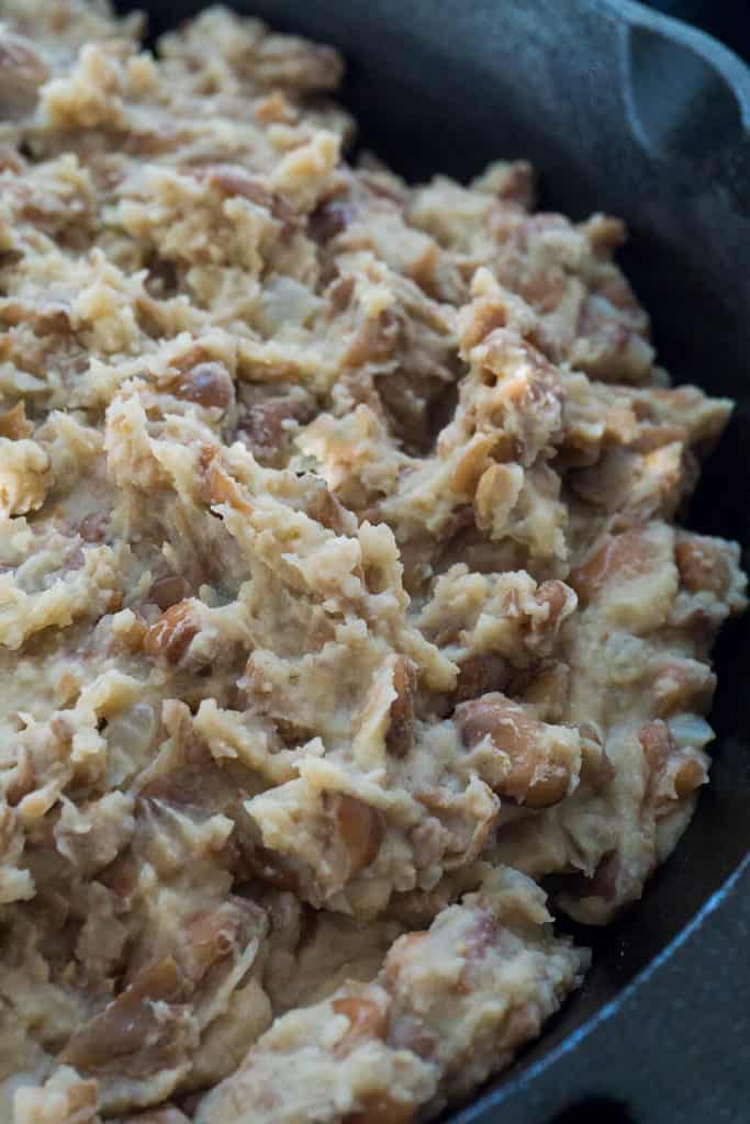 These Easy Homemade Refried Beans are fragrant with onion, garlic, and earthy pinto beans with a hint of smoky bacon.