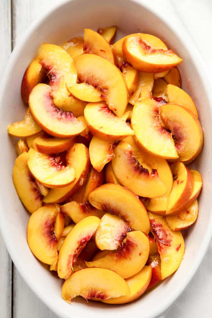 This Peach Crisp is wonderfully delicious with slices of fragrant, juicy, ripe peaches and a crunchy, sweet topping of brown sugar, oatmeal, and pecans