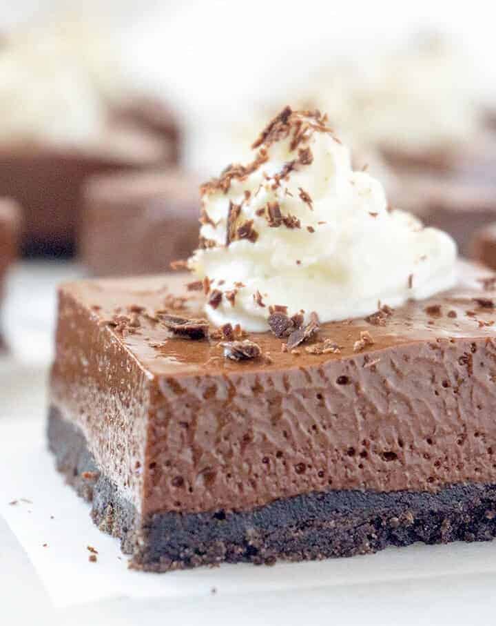 These Dreamy French Silk Pie Bars have a luxuriously dense, mousse-like filling that is incredibly rich and silky smooth with an Oreo cookie crumb crust.