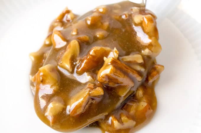 Rich and buttery, this 5 Minute Pecan Praline Sauce is full of pecans and butterscotch-y goodness. It's the perfect topping for ice cream, pancakes, and all of your favorite fall recipes. Fast and easy to make, you can pull it all together in about 5 minutes. 