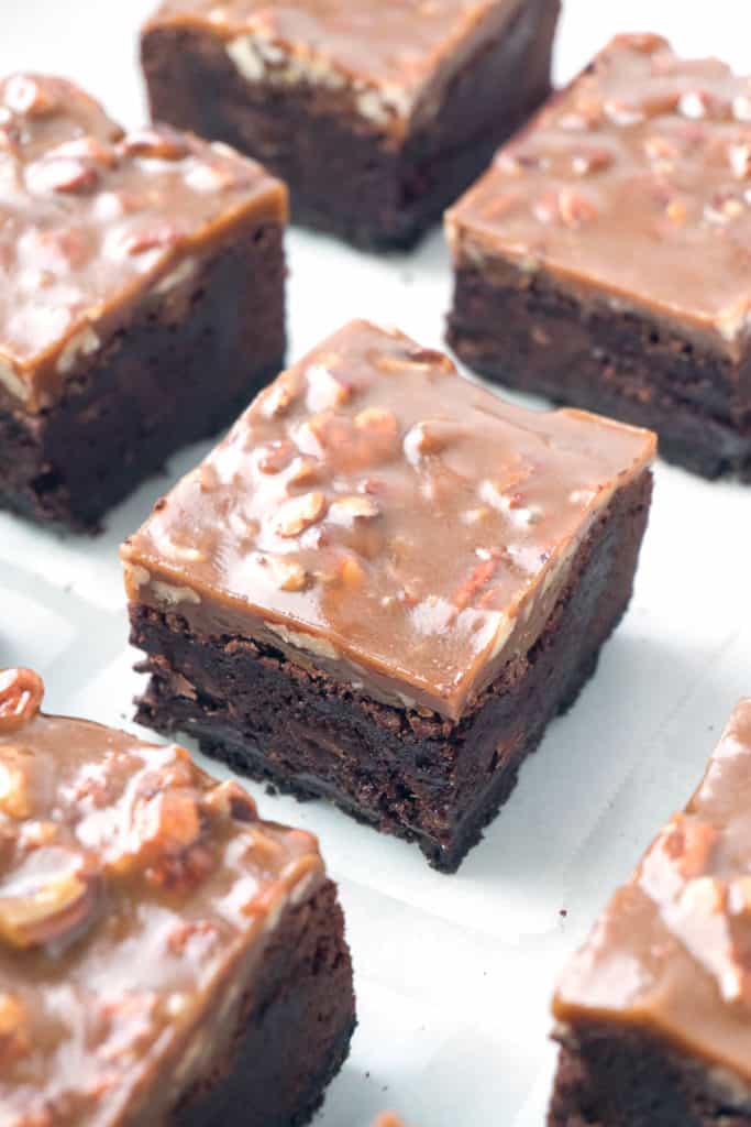 Triple-layer Fudgy Caramel Pecan Turtle Brownies - a dense, fudgy brownie on top of an Oreo cookie crust topped with a chewy caramel and pecan topping. 