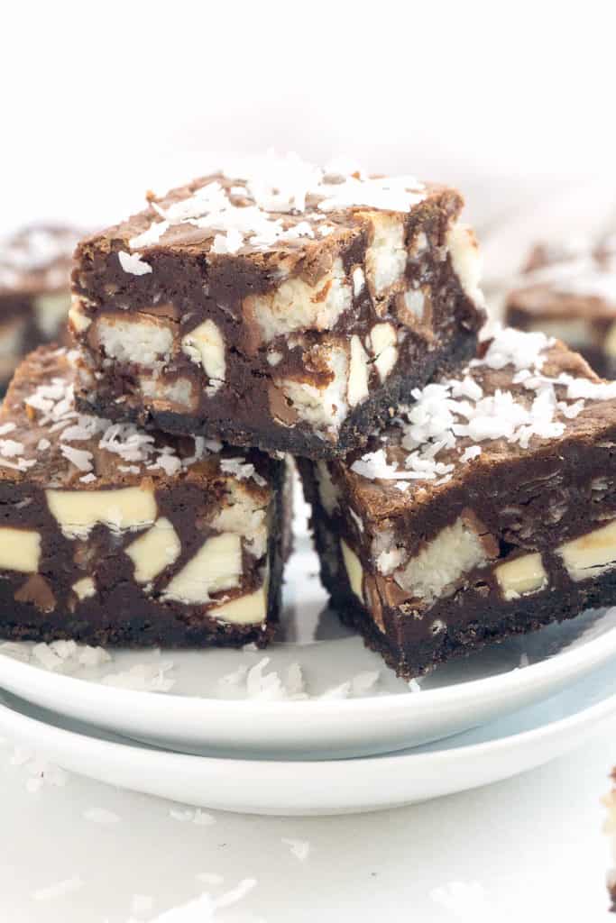 Chewy coconut, dense fudgy brownies, and smooth white chocolate - all on top of an Oreo cookie crust. Chewy, gooey, and crunchy in every bite!