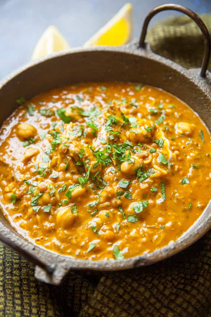 Harira - Moroccan Lamb and Legume Soup - is loaded with healthy chickpeas, lentils, and vegetables, scented with the exotic flavors of Morocco.