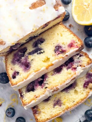 Double Glazed Blueberry Lemon Pound Cake - A moist, tender pound cake, infused with the bright and sunny flavor of lemon, bursting with sweet juicy blueberries, and topped with two (2!) glazes - one vibrant and tangy, one creamy and sweet.