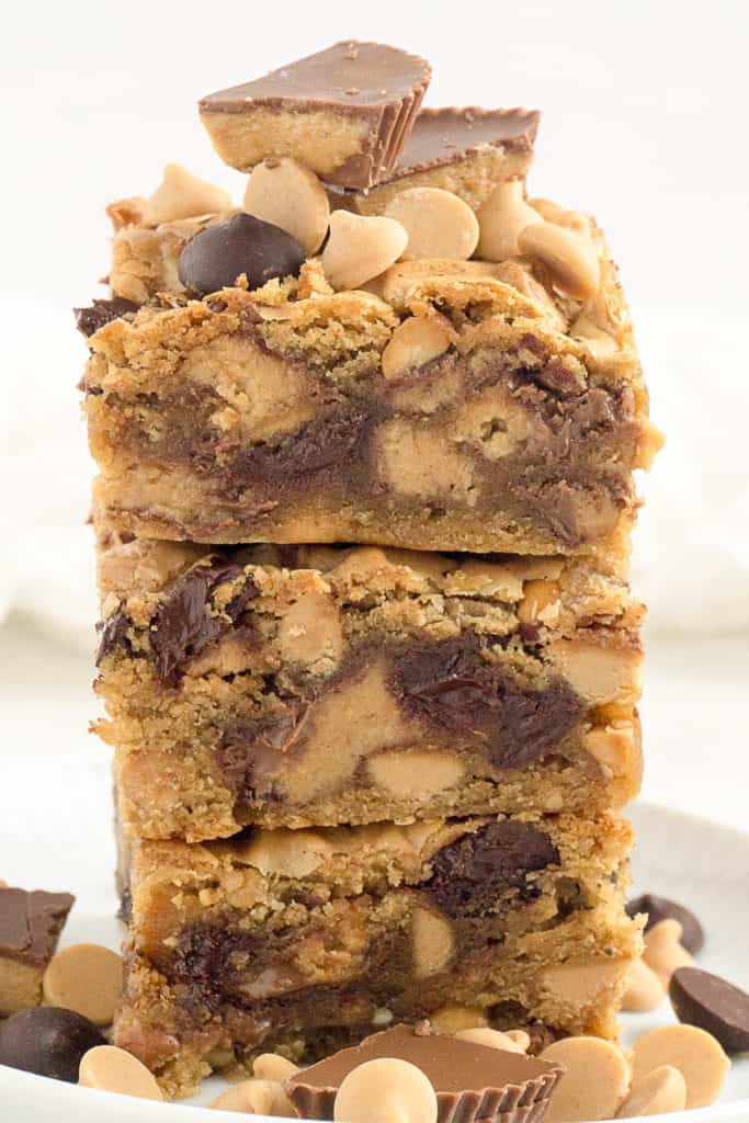 These Chunky, Chewy Peanut Butter Bars are so over the top! I packed in 18 (Eighteen!) full size Reese's peanut butter cups, peanut butter flavored chips, semi-sweet chocolate chips, and chunky peanut butter into a moist, chewy peanut butter bar. Extravagant? Definitely! But so delicious!