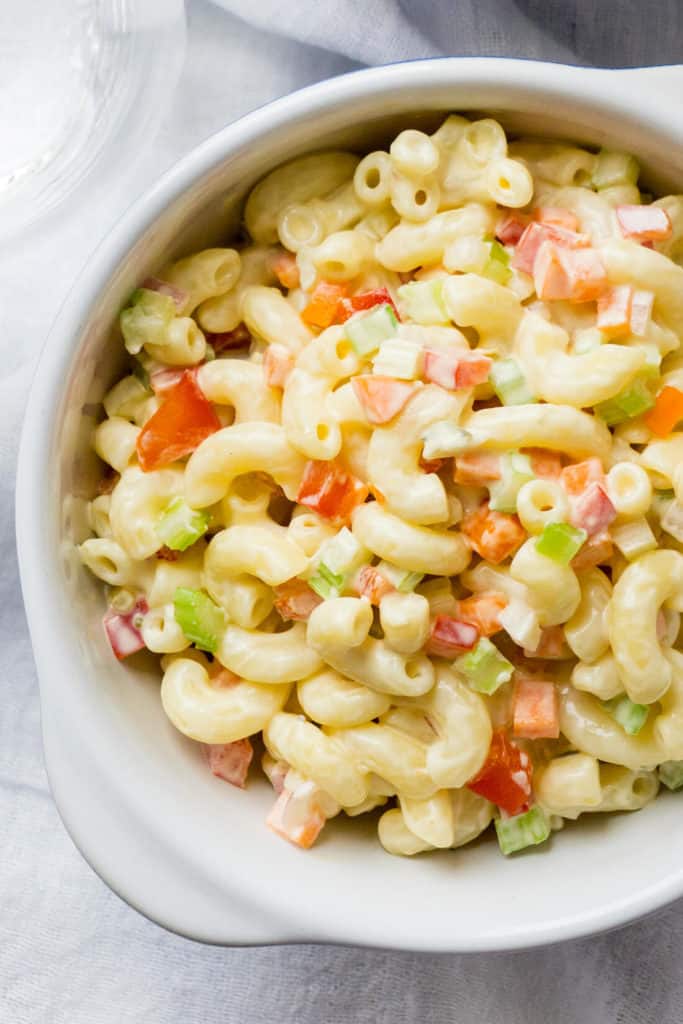 Here's my secrets to the best Classic Macaroni Salad is the best - ever! You'll never know it's lightened up because it tastes even better than the original. Lots of colorful, crunchy veggies, a fresh, creamy dressing, and the perfect balance of sweet and tangy. Perfect for summertime barbecues and picnics!