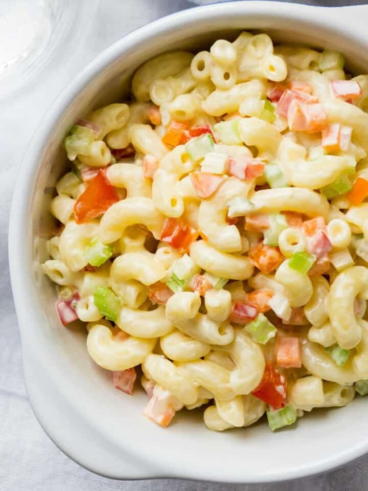 Here's my secrets to the best Classic Macaroni Salad is the best - ever! You'll never know it's lightened up because it tastes even better than the original. Lots of colorful, crunchy veggies, a fresh, creamy dressing, and the perfect balance of sweet and tangy. Perfect for summertime barbecues and picnics!