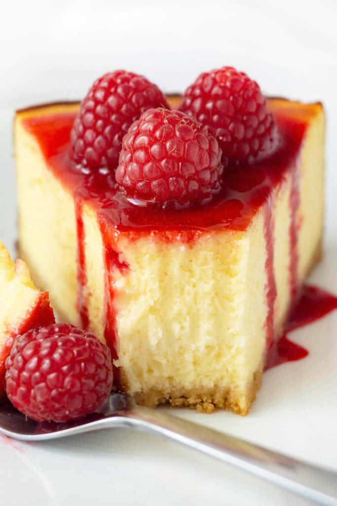 Ultra-smooth, rich and creamy white chocolate cheesecake on a buttery shortbread cookie crust, topped with raspberry sauce and fresh raspberries, this White Chocolate Raspberry Cheesecake is a favorite flavor combination.