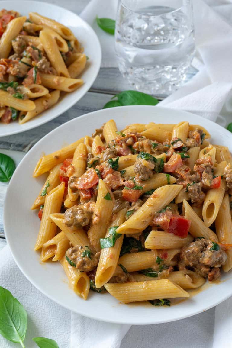 Creamy Italian Sausage and Tomato Pasta | Foodtasia