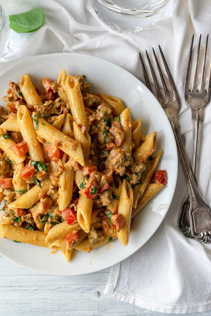 Italian sausage, sundried tomatoes, and red pepper in a creamy, cheesy sauce, this Creamy Italian Sausage and Tomato Pasta is quick and easy, and it tastes amazing. It's sure to be your new go-to dinner on busy weeknights. A family favorite!