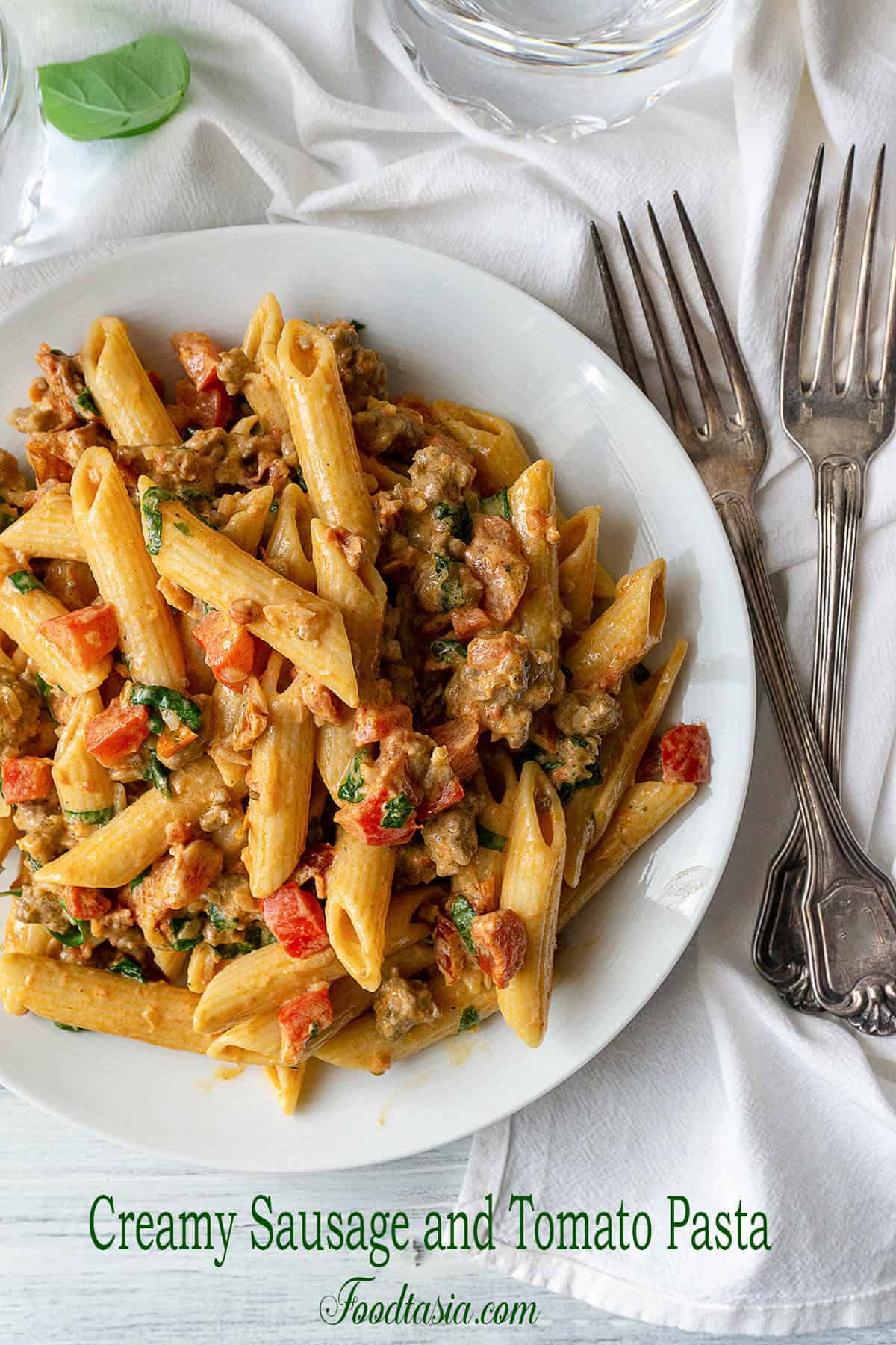 Creamy Italian Sausage and Tomato Pasta | Foodtasia