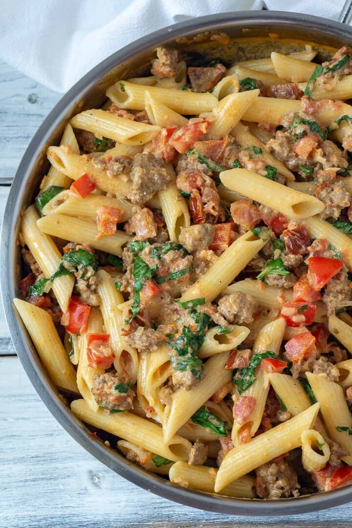 Creamy Italian Sausage and Tomato Pasta | Foodtasia