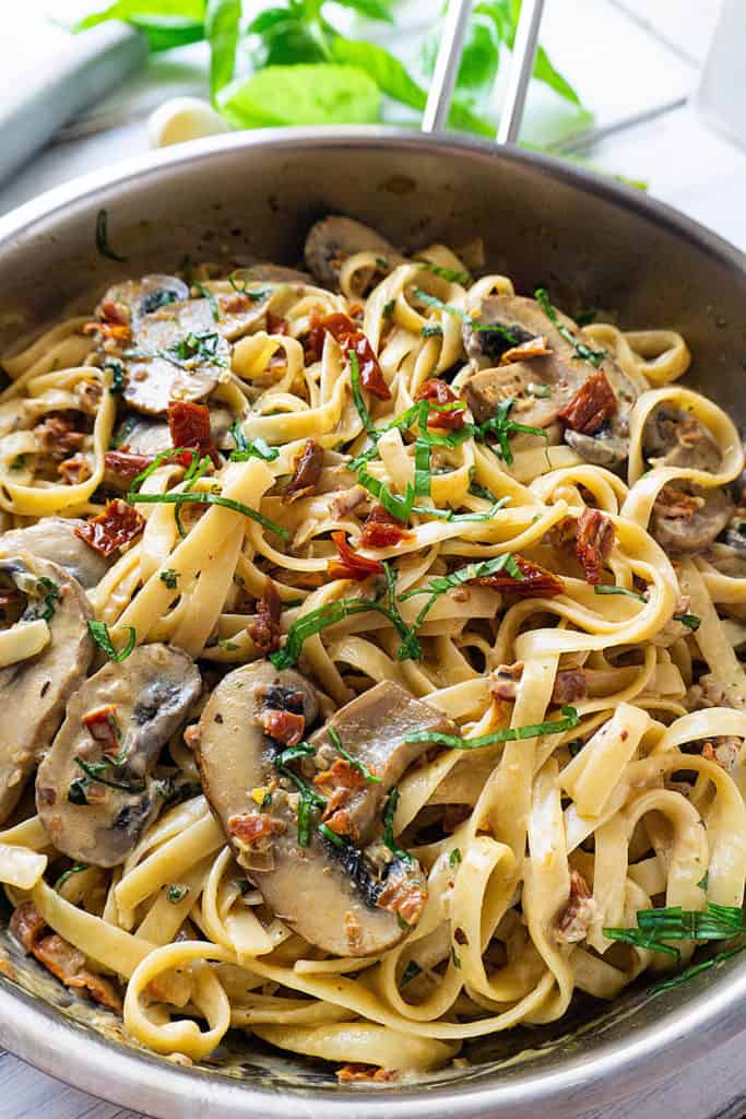 Pasta tossed with sun-dried tomatoes and sautéed mushrooms in a creamy, cheesy sauce fragrant with garlic and basil, this Sun-Dried Tomato and Mushroom Pasta is sure to become a family favorite. Quick and easy to make, it's perfect for a weeknight dinner.