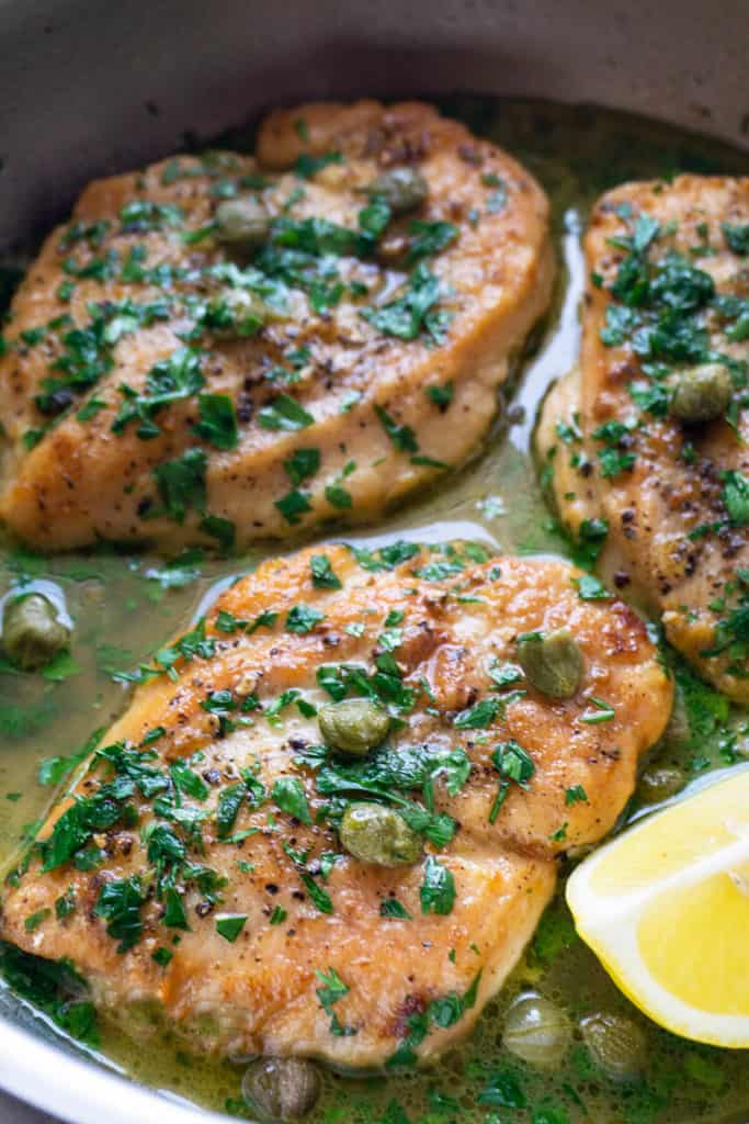 Sautéed chicken breasts in a buttery lemon, caper, and parsley sauce, this Lemon Caper Chicken is one of my most popular recipes. Super fast and easy to make, it's one of those rare, winning dishes that everyone in the family loves. Start to finish in 15 minutes - you'll definitely want to add it to your weekly rotation!