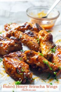 Delightfully sticky and perfectly crisp, these Baked Honey Sriracha Chicken wings are spicy, sweet, and oh so delicious! Honey and sriracha are the ultimate combination of sweet and spicy. Lime adds a bit of tang, garlic and soy sauce that umami yum. And then there’s butter….These wings have ALL THE FLAVOR. Plus, my secret to giving baked wings maximum crispness.