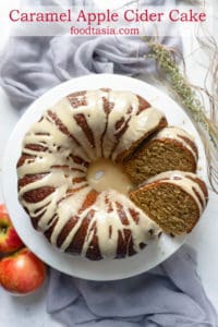 This Triple Glazed Caramel Apple Cider Cake is bursting with apple and the flavors of autumn! Shredded apples and an intense apple cider syrup flavor the moist, tender cake. Three glazes send it right over the top - an apple cider syrup glaze, an apple cider icing, and a caramel drizzle. #applecake #applecidercake #apple #applecider #falldesserts #desserts #dessertrecipes #recipe #easy #caramel #cake #bundt #easydessert #dessertfoodrecipes #easyrecipes #cakerecipes #bundtbakers #bundtcake