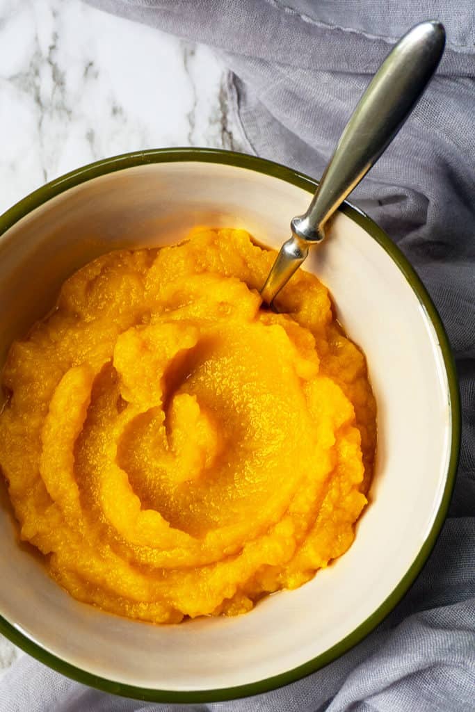 How to make the best Homemade Pumpkin Puree with deep, sweet pumpkin-y flavor and a velvety smooth texture. So easy and delicious! A surprise ingredient! #pumpkin #pumpkinpie #pumpkinrecipes #desserts #pumpkindessert #dessertrecipes #thanksgivingrecipes