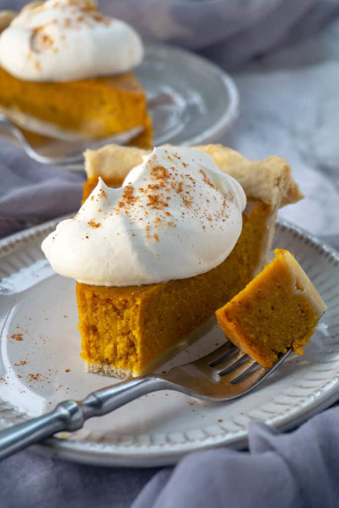 Winner of the Pumpkin Pie Challenge. Discover the secret to the Best Pumpkin Pie Recipe that's ultra-silky smooth with the deepest, richest pumpkin flavor. #pumpkin #pumpkinrecipes #pumpkinspice #thanksgiving #thanksgivingrecipes #falldesserts