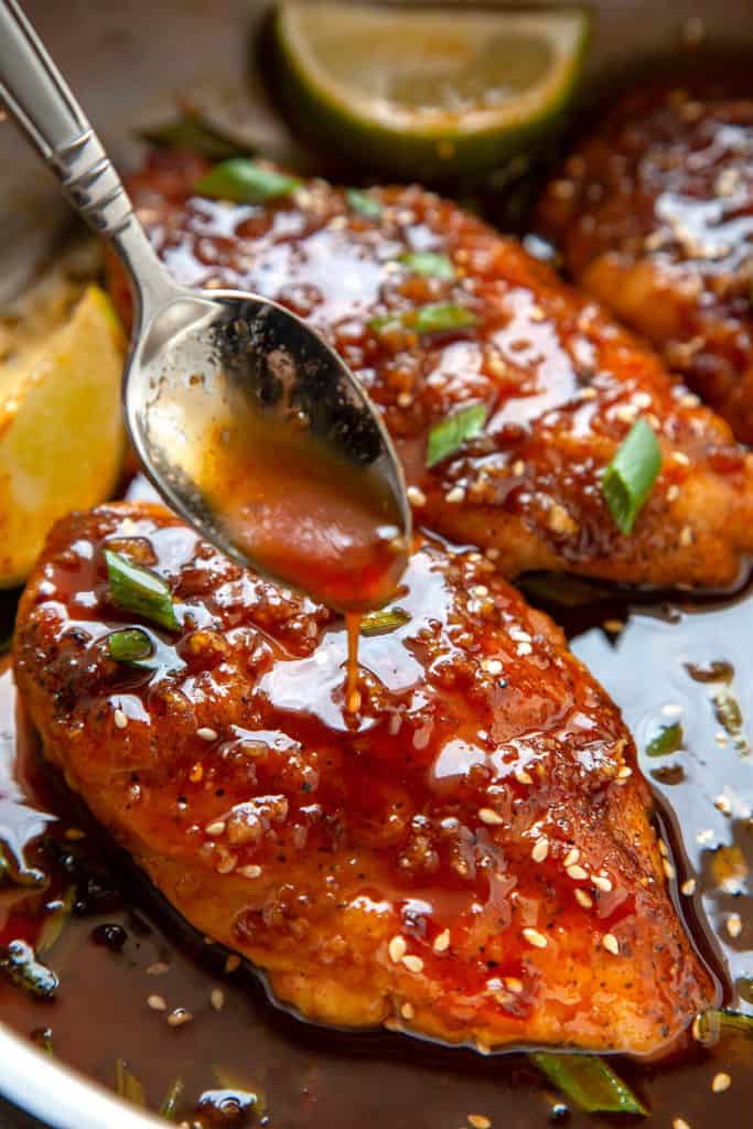 You’re going to love these 15-minute, Honey Sriracha Chicken Breasts! Juicy chicken breasts in the most epic honey sriracha sauce. This sauce is liquid gold! #chicken #chickenbreasts #dinner #easy #quick #recipe #15minutes #under30minutes #easyrecipe #sriracha