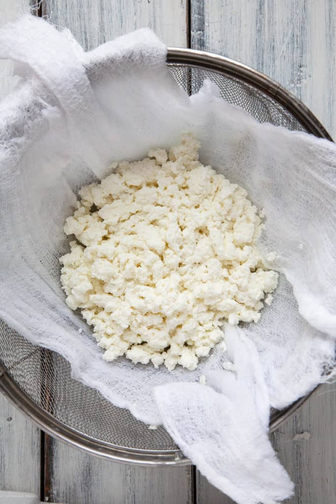 The creamiest, smoothest, most delicious homemade ricotta cheese. You won’t believe how easy and foolproof this recipe is! #ricotta #homemade #cheese #italian #creamy #easy #recipe #simple #withoutcream #cream
