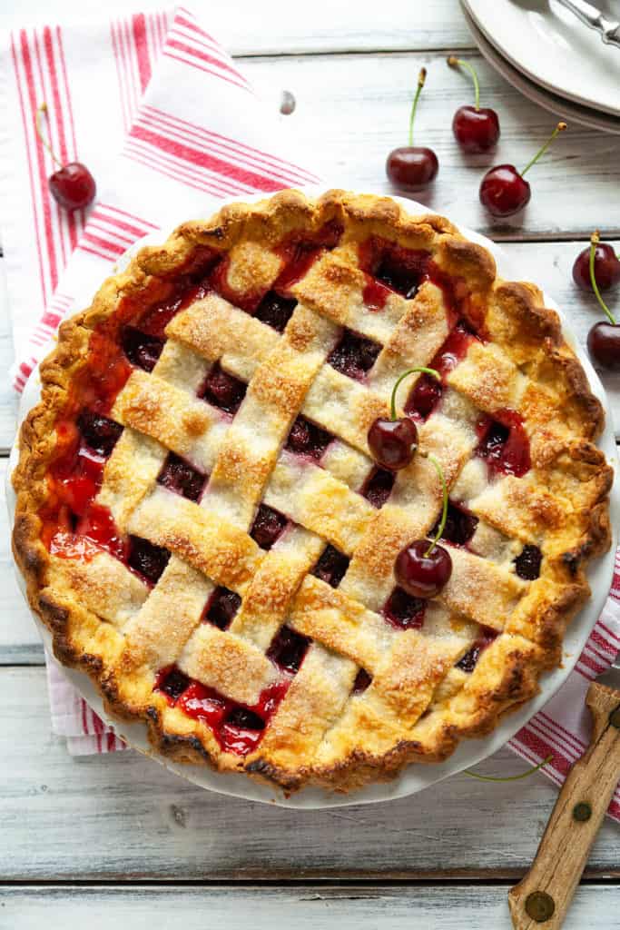 Homemade Cherry Pie is a summertime classic with its buttery, flaky crust and a beautiful, juicy cherry filling #cherry #pie #easy #lattice #tapioca #cornstarch #best #tart #sweet #homemade #fresh #recipe #fromscratch #bing