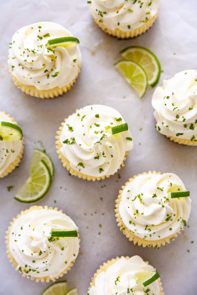 These Mini Key Lime Cheesecakes are the perfect combination of creamy, tart, and sweet in the cutest little cakes. Quick and easy to make using a muffin pan and paper liners. #cheesecake #mini #keylime #lime #dessert #recipe #easy #baked