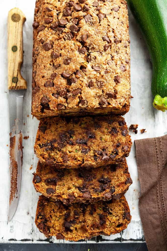 Chocolate Chip Zucchini Bread – elevating a summertime favorite to a whole new level! Super moist and tender, dotted with chocolate chips, and a crispy, crackly sugar-coated top. #zucchini #bread #recipe #chocolatechip #easy #quick #oneloaf #best #simple #moist #withbutter