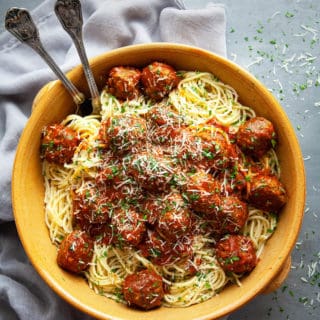 Seriously the best Spaghetti and Meatballs recipe I have ever tried. Sharing my secrets to the most juicy, tender Italian meatballs, simmered in a homemade marinara sauce. #easy #spaghettiandmeatballs #italian #pasta #best #homemade #recipe #beef #dinner #classic