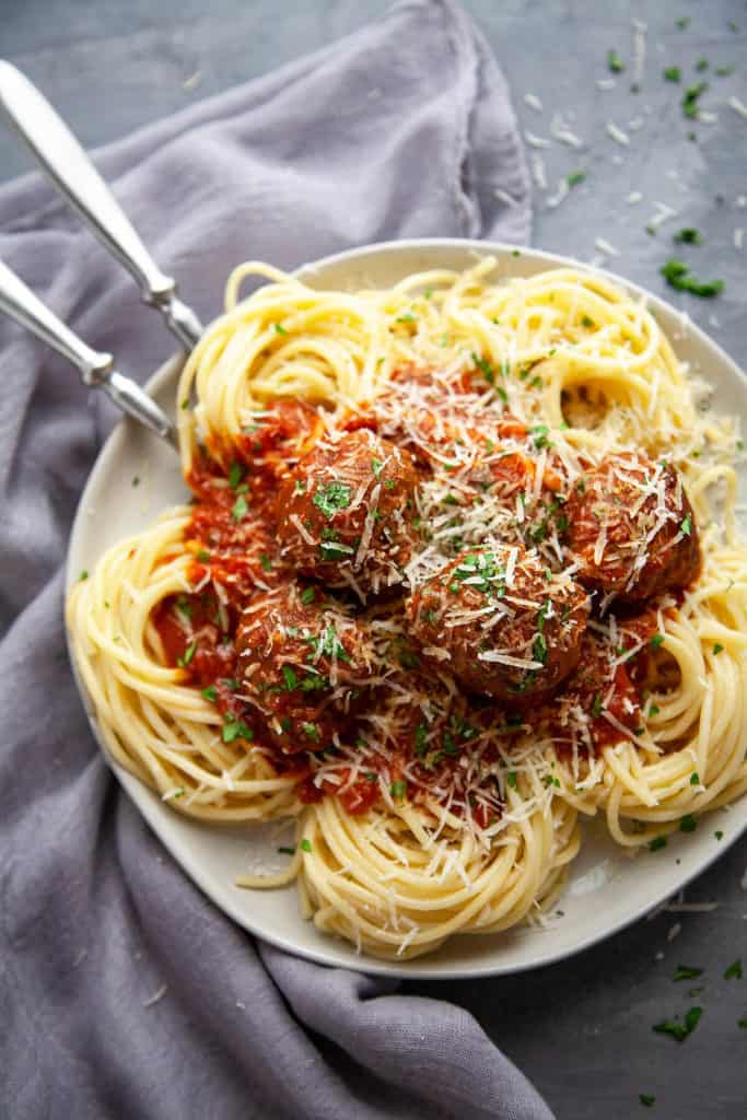 Seriously the best Spaghetti and Meatballs recipe I have ever tried. Sharing my secrets to the most juicy, tender Italian meatballs, simmered in a homemade marinara sauce. #easy #spaghettiandmeatballs #italian #pasta #best #homemade #recipe #beef #dinner #classic