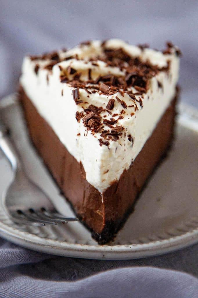 Chocolate Cream Pie is the ultimate creamy, dreamy, decadent dessert. With an Oreo cookie crust, a velvety smooth chocolate custard filling, and billows of whipped cream, this Chocolate Cream Pie will leave you swooning! #chocolate cream pie #chocolate #pie #dessert #best #homemade #no bake #recipe #from scratch #oreo #video