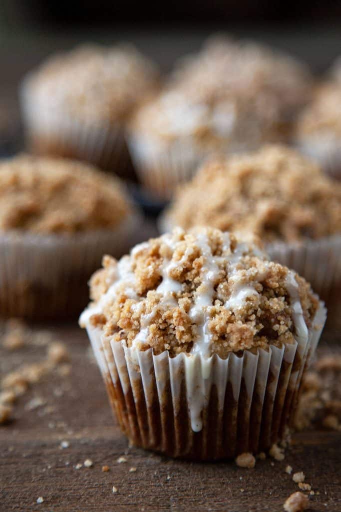 Pumpkin Streusel Muffins – a light, tender pumpkin muffin topped with the most amazing buttery, brown sugar, pumpkin spice streusel and an easy vanilla glaze. #muffins #pumpkin #streusel #crumb #quick #easy #from scratch #recipe #breakfast #cake #snack #bakery style #video
