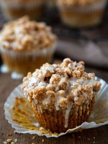 Pumpkin Streusel Muffins – a light, tender pumpkin muffin topped with the most amazing buttery, brown sugar, pumpkin spice streusel and an easy vanilla glaze. #muffins #pumpkin #streusel #crumb #quick #easy #from scratch #recipe #breakfast #cake #snack #bakery style #video