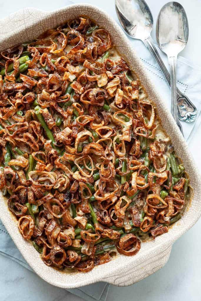 Classic Green Bean Casserole with tender green beans smothered in a creamy mushroom sauce topped with crispy fried shallots, all from scratch. A classic, Thanksgiving must-have recipe! #green bean casserole #Thanksgiving #holiday #dinner #recipe #from scratch #homemade #best #fresh #classic #make ahead