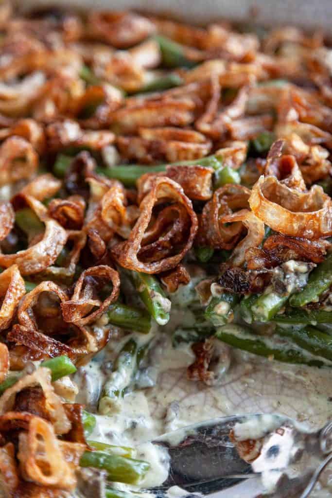 Classic Green Bean Casserole with tender green beans smothered in a creamy mushroom sauce topped with crispy fried shallots, all from scratch. A classic, Thanksgiving must-have recipe! #green bean casserole #Thanksgiving #holiday #dinner #recipe #from scratch #homemade #best #fresh #classic #make ahead
