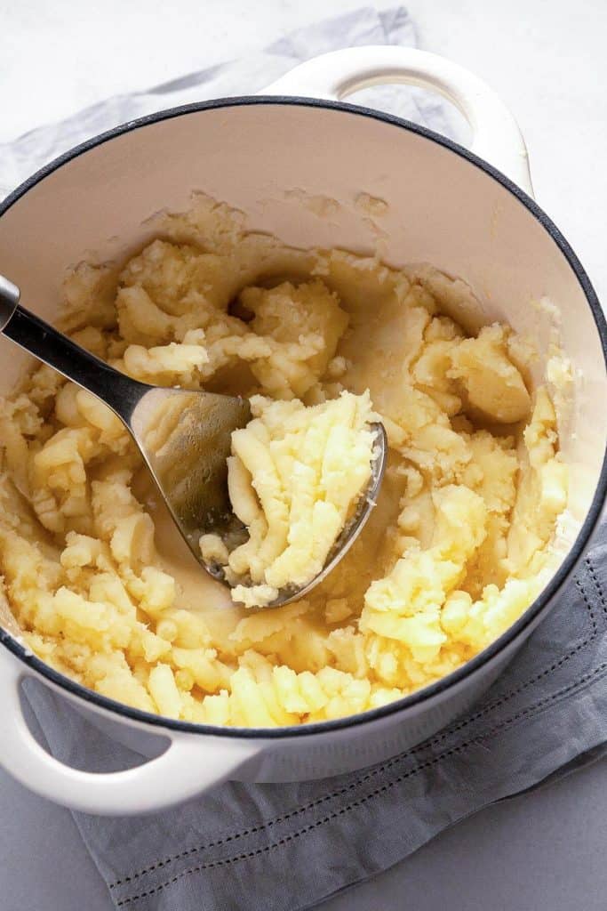 The BEST homemade Mashed Potatoes - deliciously rich and creamy, easy to make, and perfect every time. #easy #recipe #garlic #best #creamy #make ahead #Thanksgiving #homemade #russet #yukon gold #classic