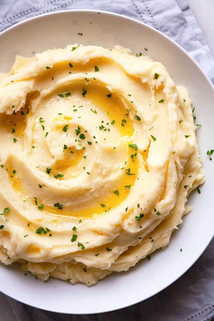 The BEST homemade Mashed Potatoes - deliciously rich and creamy, easy to make, and perfect every time. #easy #recipe #garlic #best #creamy #make ahead #Thanksgiving #homemade #russet #yukon gold #classic 