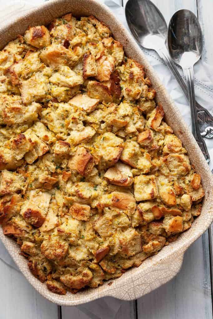The Traditional Thanksgiving Classic Stuffing recipe that the whole family loves. A deliciously easy stuffing made with simple ingredients and incredible flavor. A tried and true family favorite. #stuffing #dressing #classic #traditional #Thanksgiving #old fashioned #oven #best #quick #easy #moist #homemade #bread #recipe #casserole