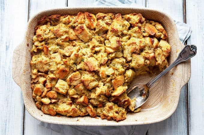 The Traditional Thanksgiving Classic Stuffing recipe that the whole family loves. A deliciously easy stuffing made with simple ingredients and incredible flavor. A tried and true family favorite. #stuffing #dressing #classic #traditional #Thanksgiving #old fashioned #oven #best #quick #easy #moist #homemade #bread #recipe #casserole