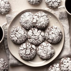 Rich and Fudgy Double Chocolate Crinkle Cookies are irresistibly soft, tender, and chewy. With a fudgy brownie interior and a cookie crunch on the outside. A classic holiday favorite! #crinkle cookie #earthquake cookie #chocolate #cookies #holiday #christmas #best #from scratch #recipe #homemade #easy