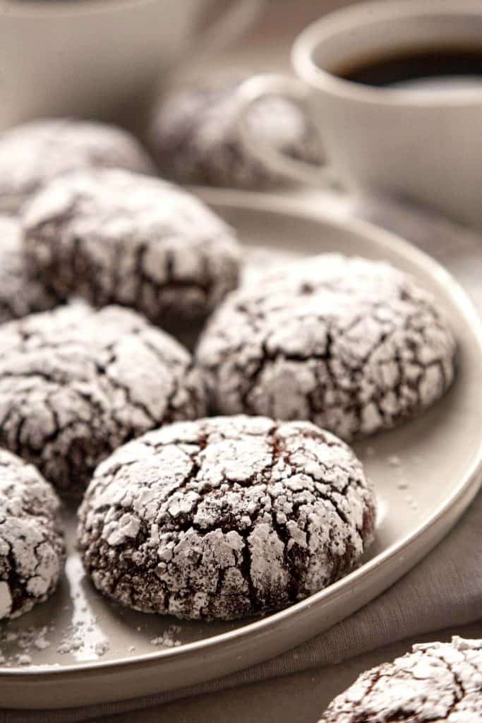 Rich and Fudgy Double Chocolate Crinkle Cookies are irresistibly soft, tender, and chewy. With a fudgy brownie interior and a cookie crunch on the outside. A classic holiday favorite! #crinkle cookie #earthquake cookie #chocolate #cookies #holiday #christmas #best #from scratch #recipe #homemade #easy