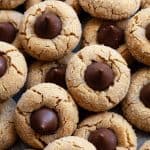 Peanut Butter Blossoms – soft and chewy peanut butter cookies topped with a chocolate kiss. Their sweet and salty combination is irresistible! #peanut butter blossoms #easy #from scratch #best #butter #peanut butter #cookies #holiday #christmas #without shortening #hersheys #soft #chewy #classic #original #perfect
