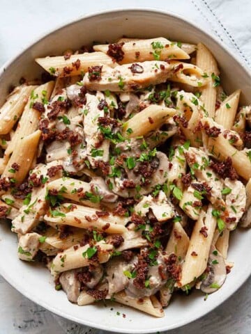Chicken Bacon Mushroom Pasta in a creamy, garlicky parmesan sauce. A quick and easy pasta dish that the whole family will love. Ready in under 30 minutes.